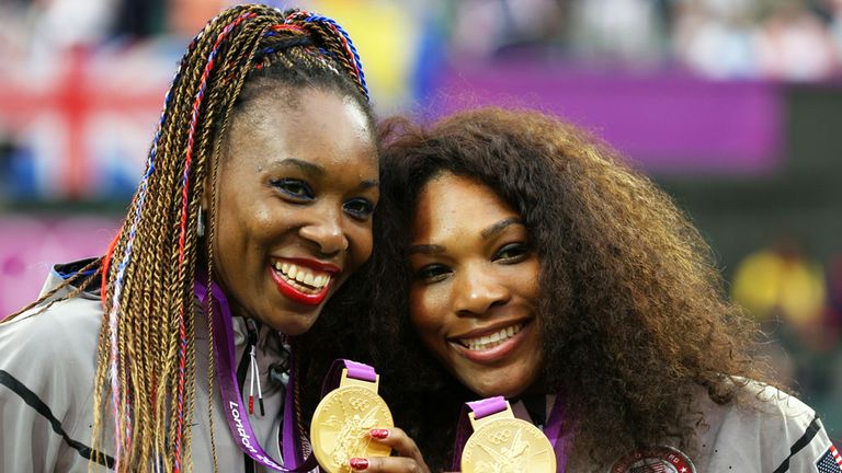 Serene Williams with her sister Venus (L) after winning Olympic Gold in 2012