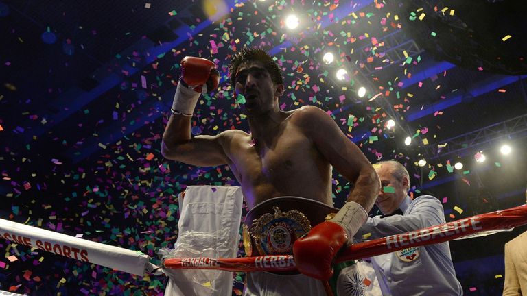 India's boxer Vijender Singh celebrates after defeating Australia's boxer Kerry Hope for the WBO Asia Pacific Super Middleweight title in New Delhi on July