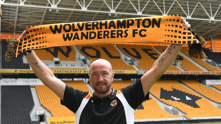 Walter Zenga the new head coach of Wolverhampton Wanderers holds up a scarf as he takes his first training session, August 1 2016