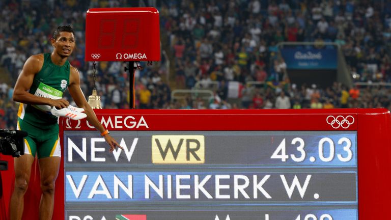 Wayde van Niekerk of South Africa celebrates winning gold and setting a new world record in 400m Olympics final