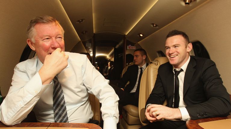 Sir Alex Ferguson and Wayne Rooney talk on the plane home after the FIFA Ballon d'Or Gala in 2011