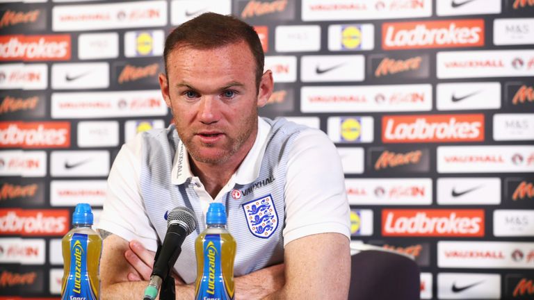 Wayne Rooney of England talks during the England Press Conference at St George's Park on August 30, 2016 in Burton