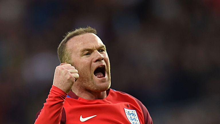 England's striker Wayne Rooney celebrates after scoring his team's second goal during the friendly football match between England and Australia at the Stad