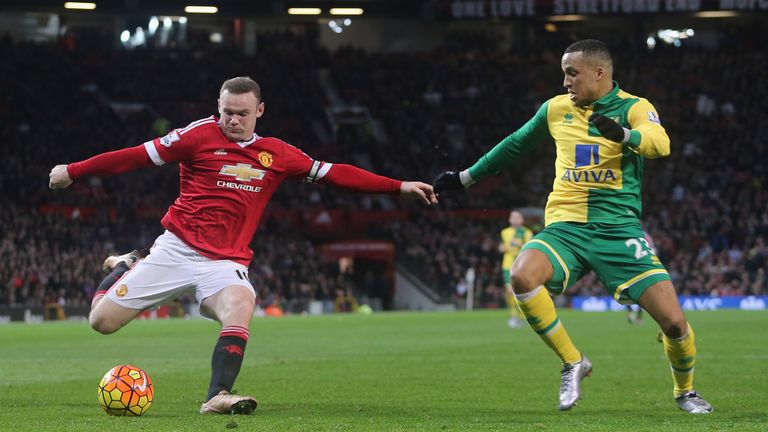 Wayne Rooney  of Manchester United in action with Martin Olsson of Norwich City during the Barclays Premier League match 