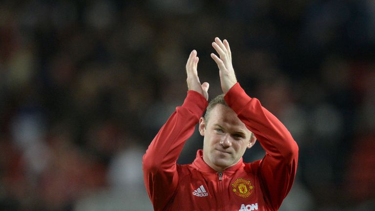 Manchester United's English striker Wayne Rooney applauds the fans at the end of the friendly Wayne Rooney testimonial football match between Manchester Un
