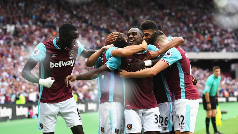 LONDON, ENGLAND - AUGUST 21:  Michail Antonio (#30) of West Ham United celebrates scoring the opening goal with team mates during the Premier League match 