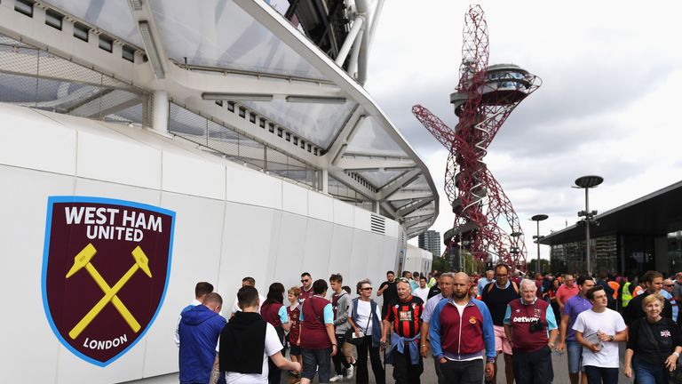 LONDON, ENGLAND - AUGUST 21: Fans walk outside the ground prior to the Premier League match between West Ham United and AFC Bournemouth at London Stadium o