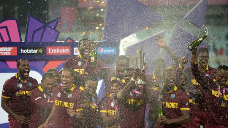 West Indies's captain  Darren Sammy (C) holds the trophy after winning the World T20 cricket tournament final against England