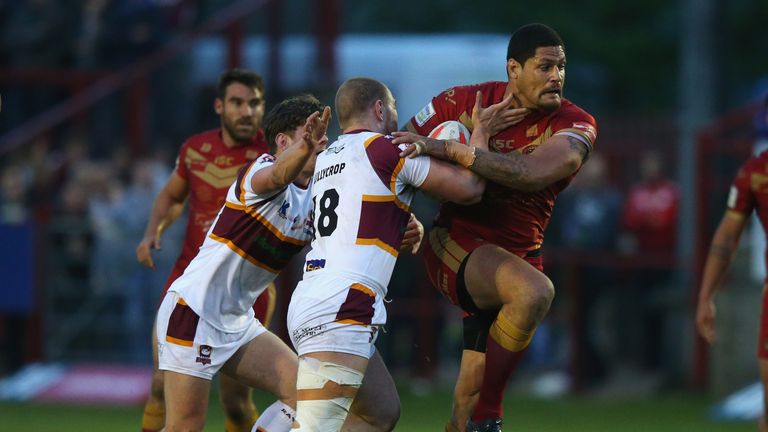 BATLEY, ENGLAND - MAY 06:  Willie Mason of Catalan Dragons is tackled by Tom Lillycrop of Batley Bulldogs during the Ladbrokes Challenge Cup Sixth Round ma