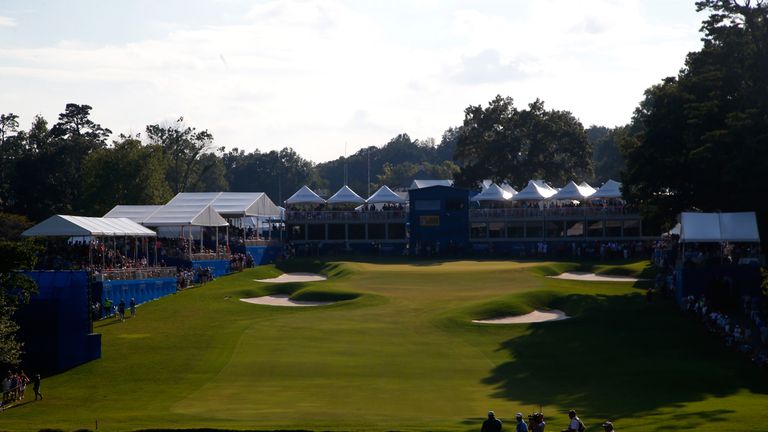 GREENSBORO, NC - AUGUST 23:  Jason Gore waits to play his second shot on the 18th hole during the final round of the Wyndham Championship at Sedgefield Cou