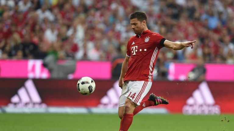 Bayern Munich's Spanish midfielder Xabi Alonso scores the first goal during the German first division Bundesliga football match between FC Bayern Munich vs