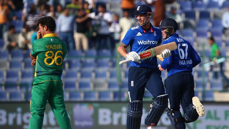 England's Alex Hales (C) and Jason Roy (R) run between the wickets as Pakistan's Yasir Shah (L) reacts during the second ODI