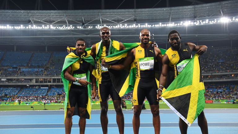 (FromL) Jamaica's Yohan Blake, Jamaica's Usain Bolt, Jamaica's Asafa Powell and Jamaica's Nickel Ashmeade celebrate after they won the Men's 4x100m Relay F