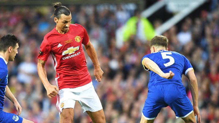 Manchester United striker Zlatan Ibrahimovic takes on two Everton defenders