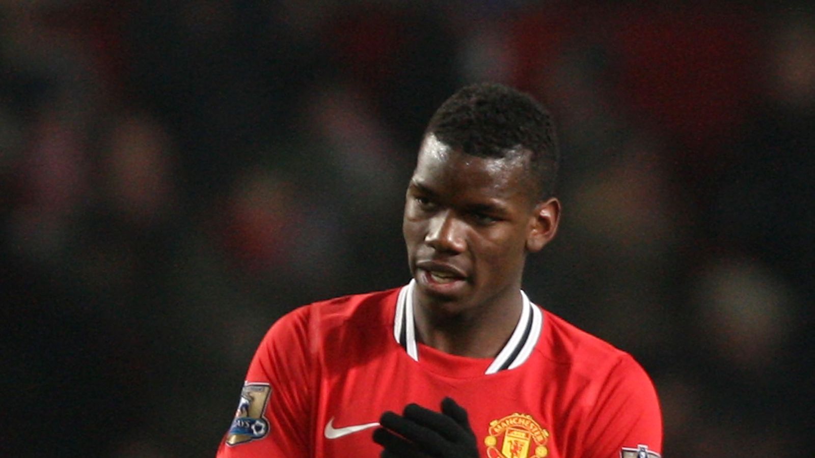 Manchester United footballer Paul Pogba stands out as he takes