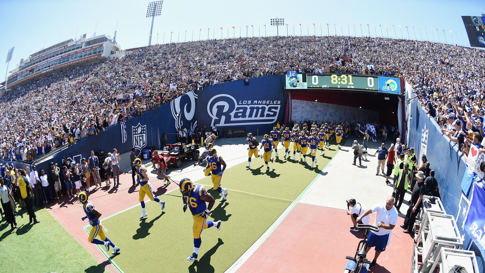 A fan wears Los Angeles Rams colors before a preseason NFL