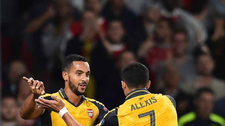 Arsenal's Theo Walcott celebrates with Alexis Sanchez after scoring his second during the Champions League game against FC Basel at the Emirates Stadium.