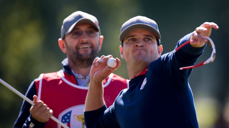 USA's Zach Johnson throws his ball as he celebrates his win during the Morning Foursome matches at the 41st Ryder Cup at Hazeltine