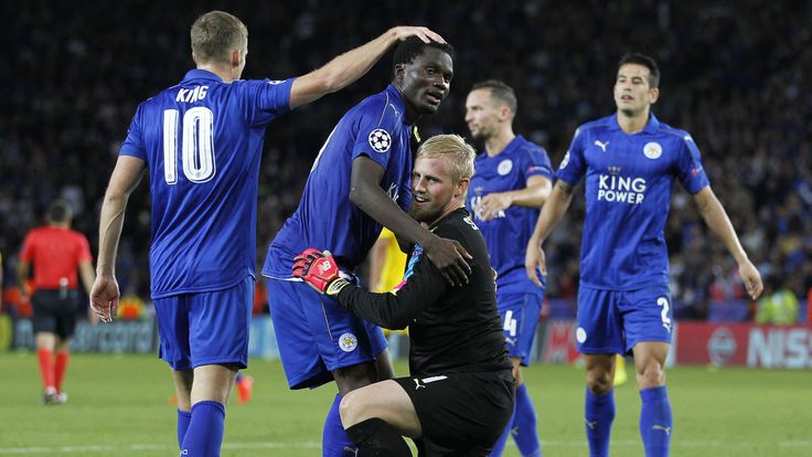 Leicester City goalkeeper Kasper Schmeichel celebrates with teammates 