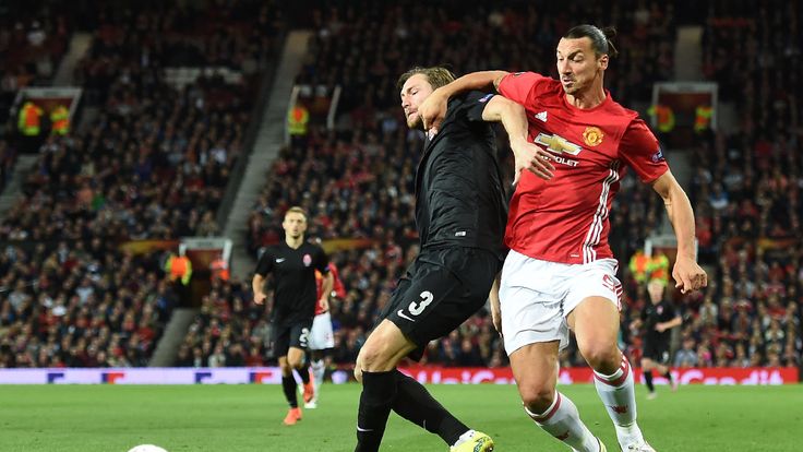 Manchester United's Swedish striker Zlatan Ibrahimovic (R) vies with Zorya's Belarusian defender Mikhail Sivakov during the UEFA Europa League group A foot