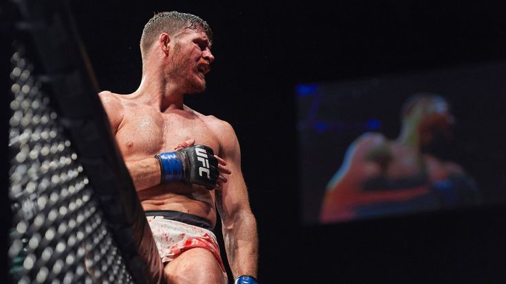 British fighter Michael Bisping celebrates after his fight with Anderson Silva of Brazil (not pictured) in their middleweight bout at the Ultimate Fighting