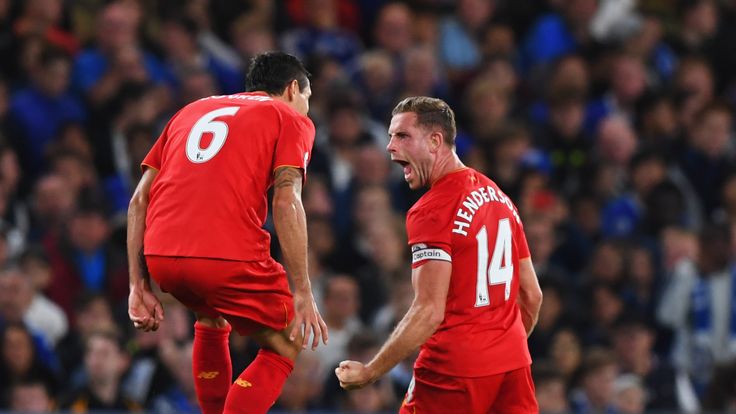 Jordan Henderson (R) celebrates hs goal with team-mate Dejan Lovren