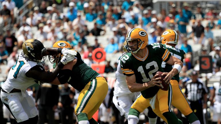 JACKSONVILLE, FL - SEPTEMBER 11:  Aaron Rodgers #12 of the Green Bay Packers rolls out during the game against the Jacksonville Jaguars at EverBank Field o