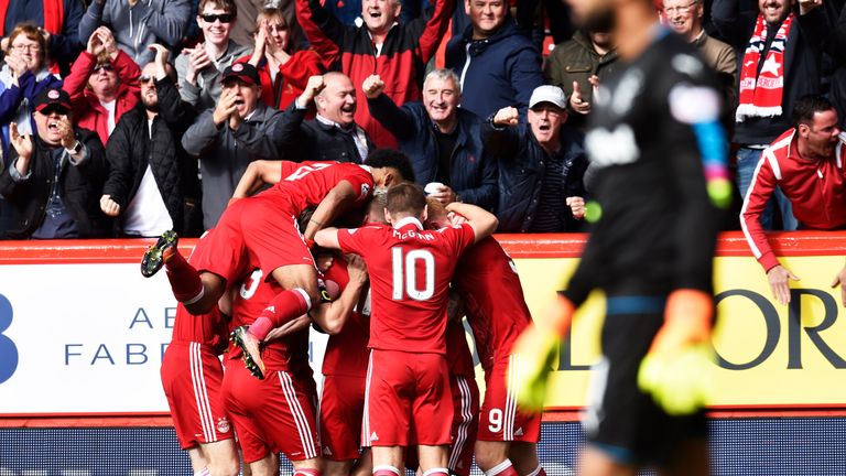Aberdeen players celebrate after Jonny Hayes opened the scoring against Rangers