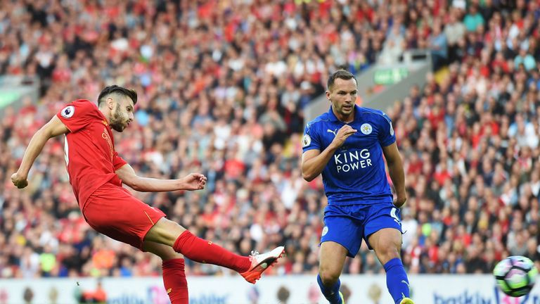 Danny Drinkwater looks on as Adam Lallana (L) shoots and scores Liverpool's third goal