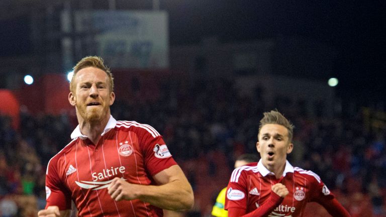 Adam Rooney celebrates after scoring the late winner for Aberdeen against St Johnstone in the Scottish League Cup quarter-final