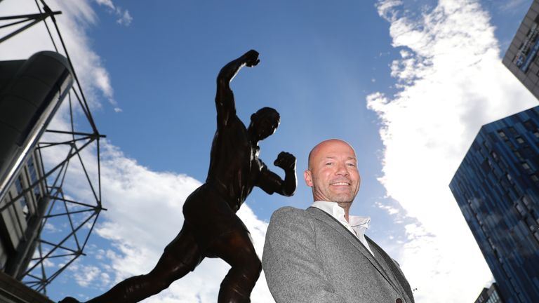 Alan Shearer poses next to the newly-unveiled statue of himself outside St James' Park