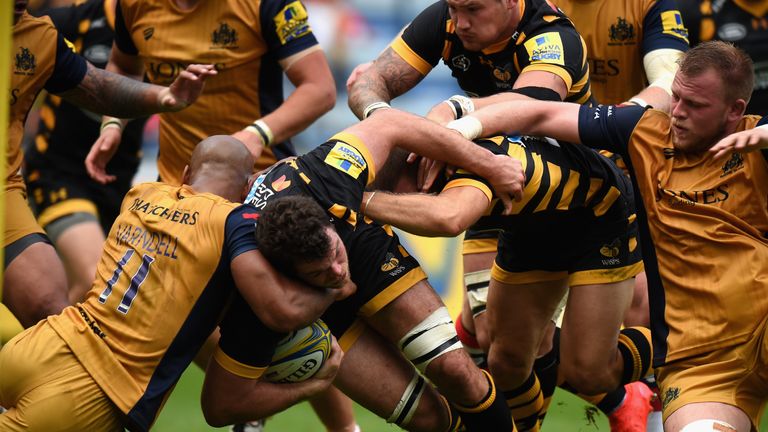 Alex Rieder of Wasps is tackled by Tom Varndell of Bristol Rugby during the Aviva Premiership match between Wasps and Bristol