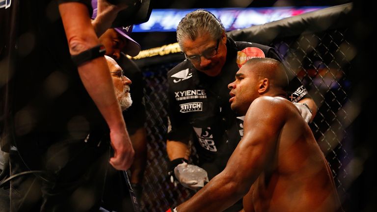 BOSTON, MA - AUGUST 17: Alistair Overeem sits in the corner and is tended to by medical staff after being knocked out by Travis Browne in their heavyweight