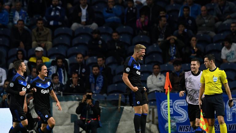 Copenhagen's forward Andreas Cornelius (C) celebrates after scoring the equaliser against Porto