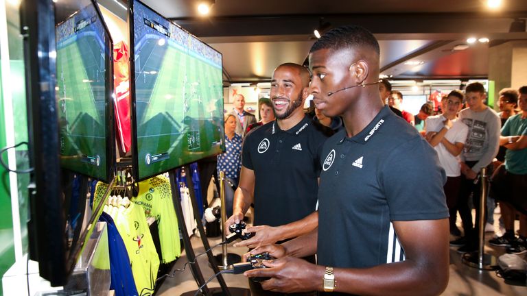 Andros Townsend and Sullay Kaikai demo the new FIFA 17 game by EA Sports at the adidas store in London ahead of the September 2016 release