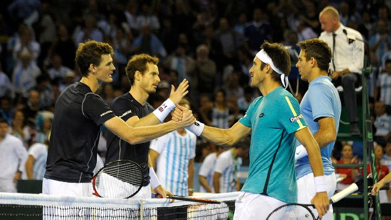 Andy Murray and Jamie Murray greet Argentina's Juan Martín Del Potro and Leonardo Mayer after winning the Davis Cup semi-final 