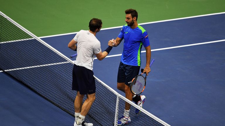 NEW YORK, NY - SEPTEMBER 01:  Andy Murray of Great Britain (L) shakes hands with Marcel Granollers of Spain after their second round Men's Singles match on