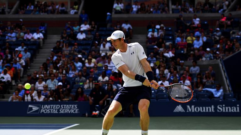 Andy Murray returns a shot to Kei Nishikori 