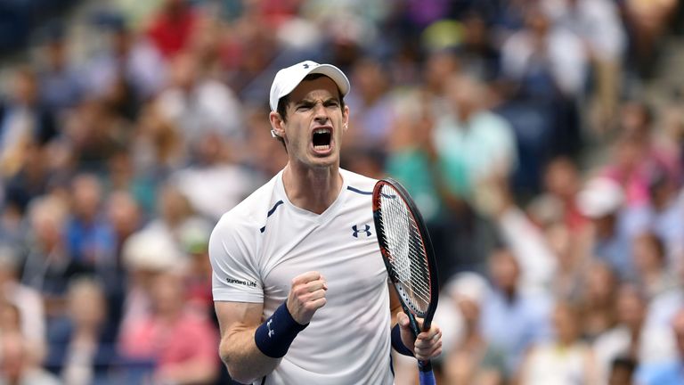 Andy Murray of Britain reacts to winning a set against Kei Nishikori 