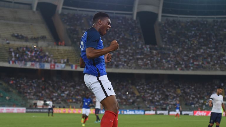 Anthony Martial celebrates after scoring for France against Italy