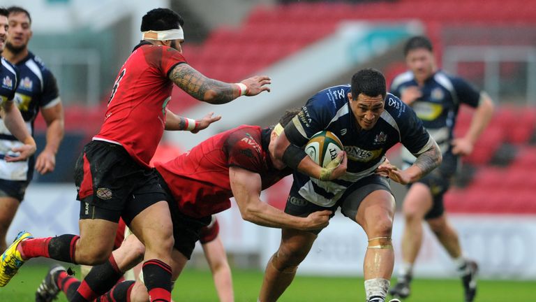 Anthony Perenise of Bristol is tackled by Will Rowlands of Jersey during the Greene King IPA Championship 