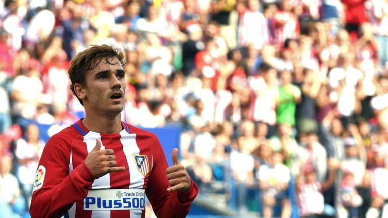 Atletico Madrid's French forward Antoine Griezmann celebrates after scoring during the Spanish league football match Club Atletico de Madrid vs Real Sporti