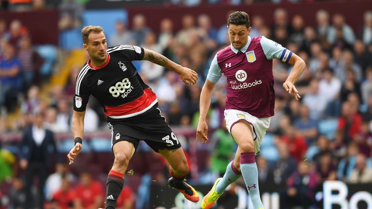 Apostolos Vellios of Nottingham Forest in action with Tommy Elphick of Aston Villa 