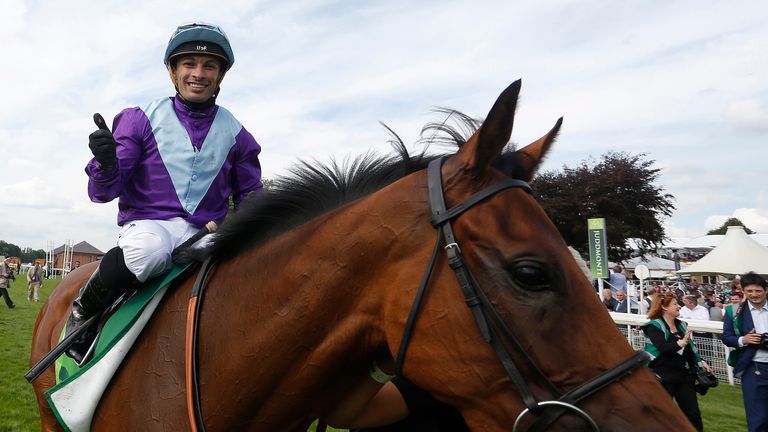 Silvestre De Sousa riding Arabian Queen celebrates winning The Juddmonte International Stakes at York in 2015