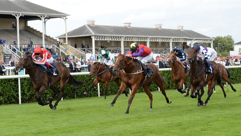 Ardad and Frankie Dettori (left) come with a late surge to win the Pepsi Max Flying Childers Stakes.