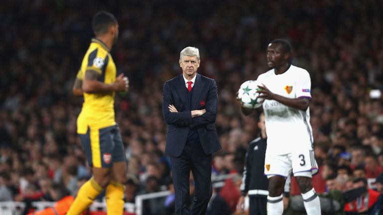 Arsene Wenger [centre] was delighted with his side's first-half display