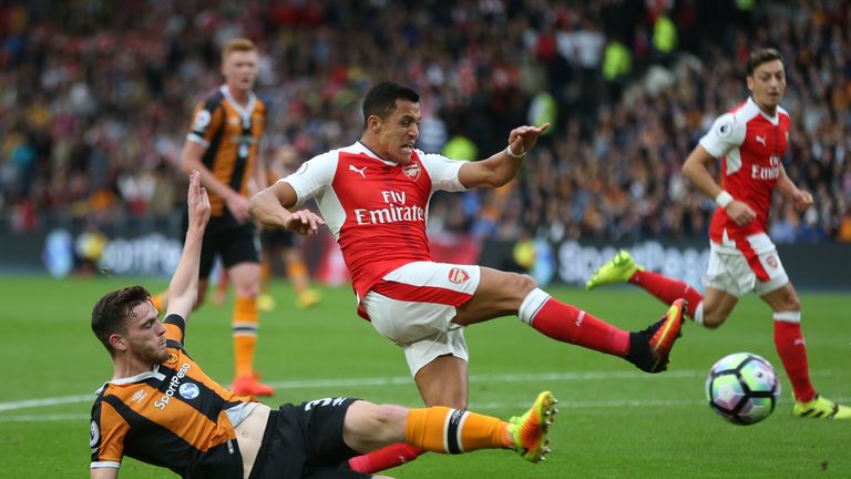 Andrew Robertson tackles Alexis Sanchez