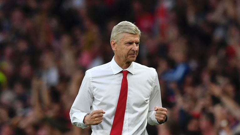 Arsenal's French manager Arsene Wenger celebrates after Arsenal scored their third goal during the English Premier League football match between Arsenal an