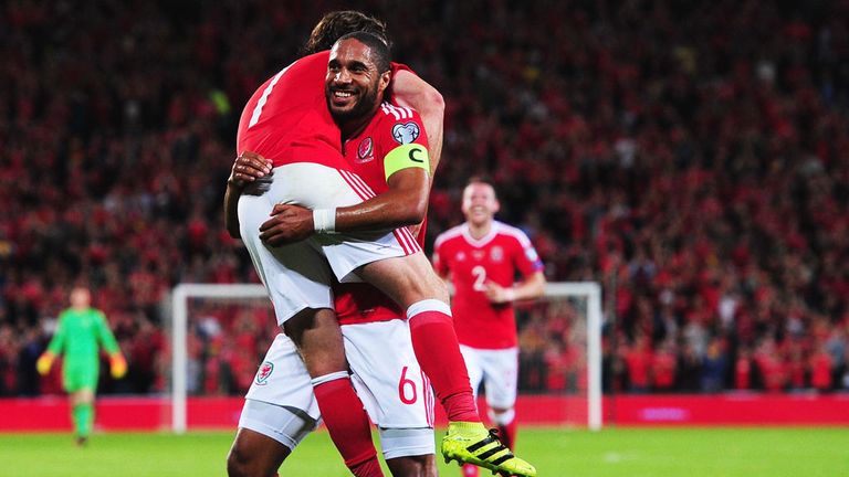 Ashley Williams celebrates with Joe Allen after the midfielder scored his first international goal