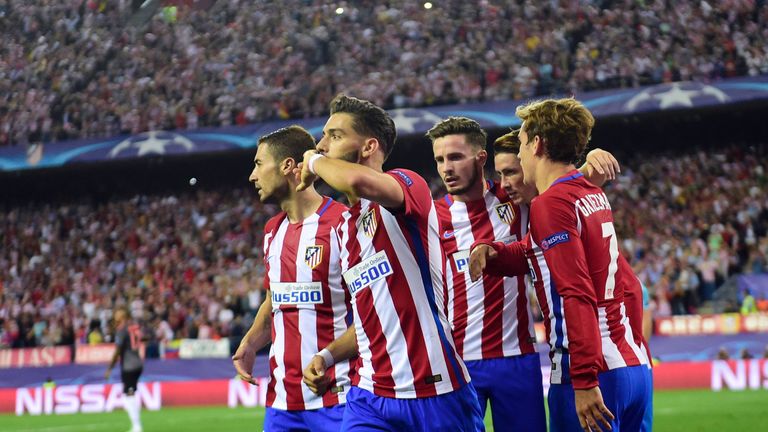 Atletico Madrid midfielder Yannick Ferreira Carrasco (2ndL) celebrates with team-mates 